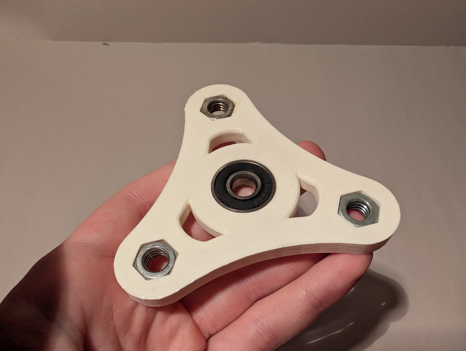 ABS 3D printed fidget spinner with press-fit bearing and captive nuts